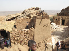 Dogon houses require occasional maintenance work