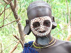 young Surma boy disguised as a woman.