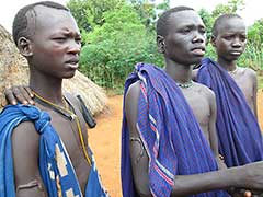 Scarification is a big tradition with the Surma : note the boys' arms.