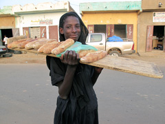 Some freshly baked bread ? : a young Soninke man.