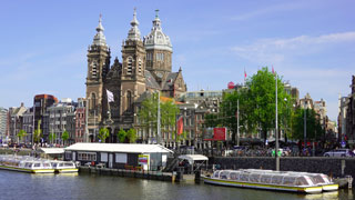 In front of the Central Train Station of Amsterdam, the Basilica of Saint Nicholas